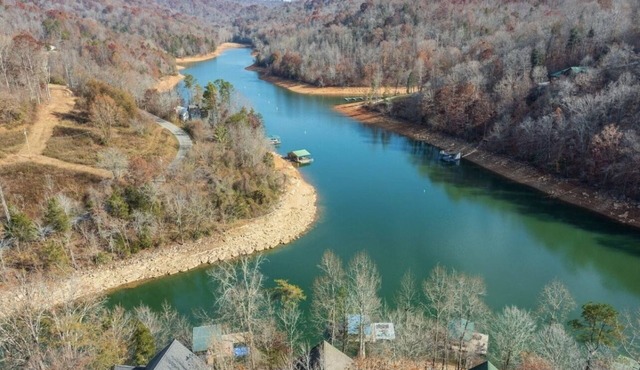 Lakefront home that can sleep 15 with private dock and hot tub in private cove!