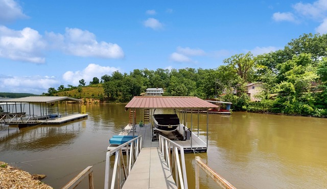 Lakefront home with 2 living rooms, 2 decks, grill, dock, foosball & w/d