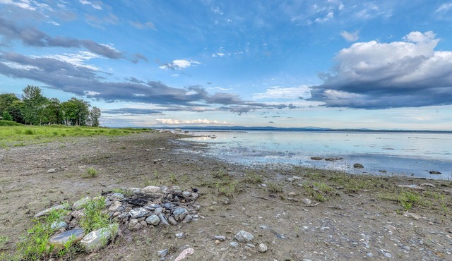 Lakefront home with 17 acres - amazing water views, sauna, inviting deck