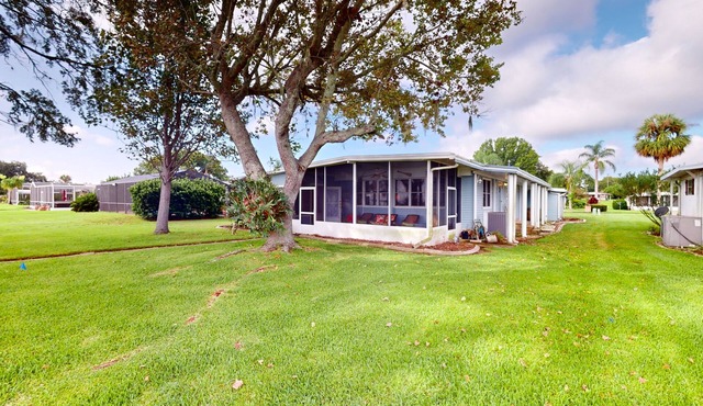 Lakefront home with al fresco dining, dock, office, expansive interior, & W/D