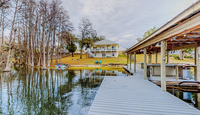 Lakefront home with amazing sunset/water view, private dock, & firepit