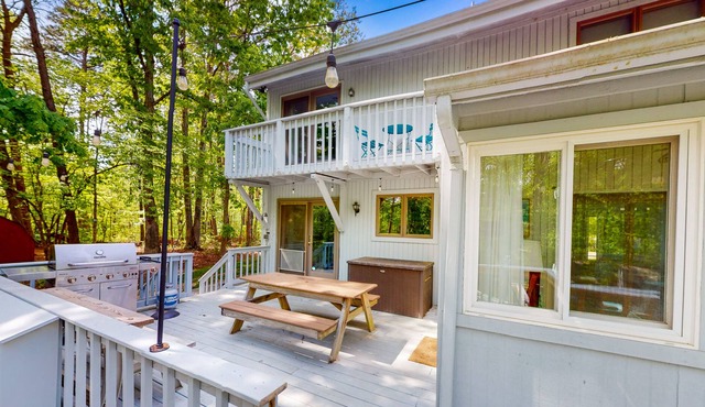 Lakefront home with hot tub, WiFi, dock, lake views, AC, & wood fireplace