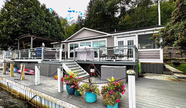 Lakefront home with private dock, lake views, kayaks, grill, large covered deck