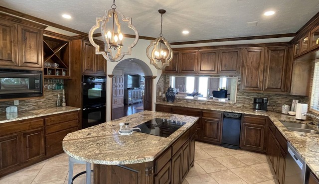 Lakefront home with private dock, great fishing and game room.