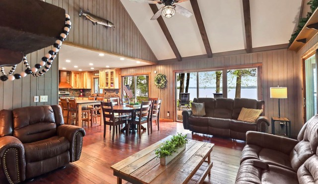 Lakefront home with tennis court, pool table, dock, enclosed porch, and firepit!