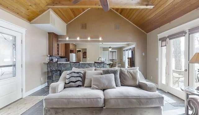 Lakefront house with great kitchen, fireplace, and deck.