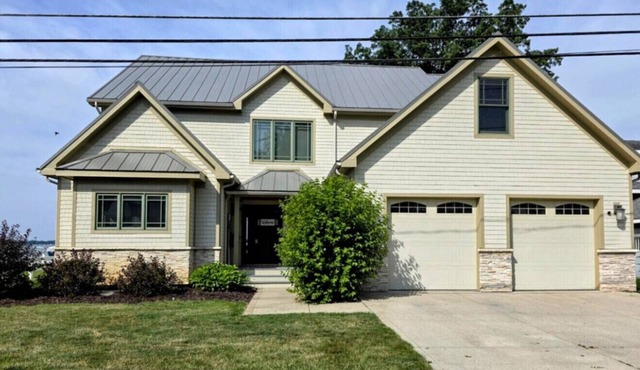 Lakefront House with Newly Added Parking. Enjoy Golden Sunsets & Sandy Shoreline