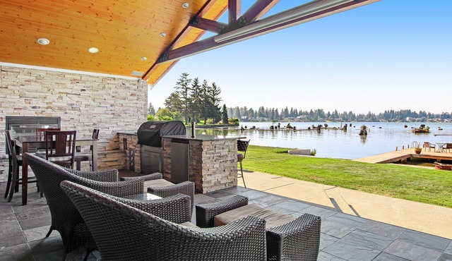 Lakefront house with built-in bar & grill, fireplace, beach, & dock