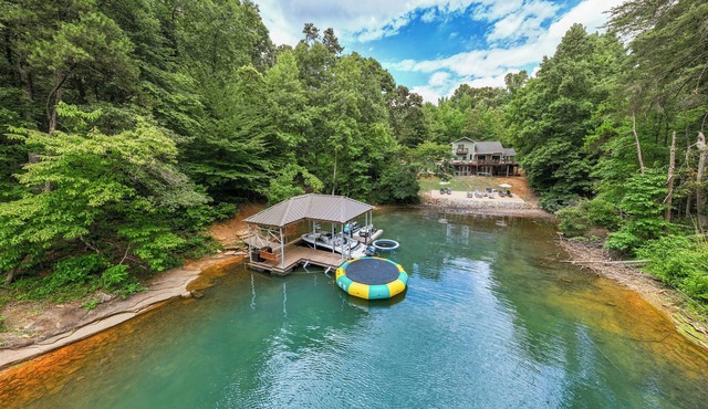 Lakefront Private Cove Retreat w/Sandy Beach, Dock, Hot Tub + Boat & Ski Option