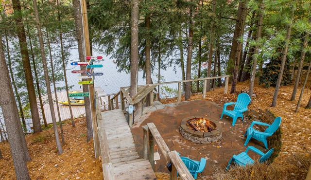 Lakefront retreat 30 min to Traverse City. Hot tub, fire pit, kayaks, game room.