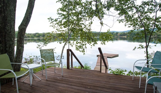 Lakefront retreat with pool, private dock and tennis court