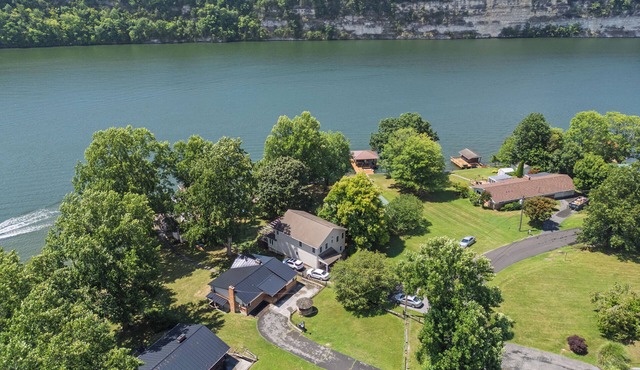 Lakefront retreat with private dock, open living, fire pit, full kitchen & cozy indoor spaces