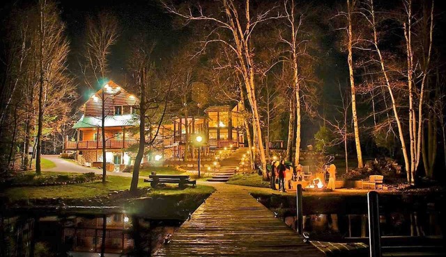 Lakefront secluded mult-family retreat with game room and two cabins.