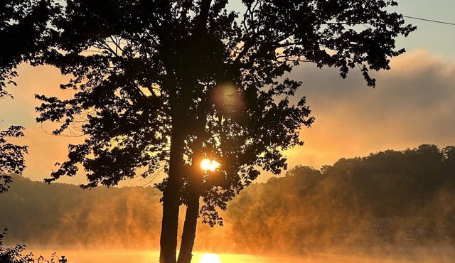 Lakehouse with beautiful setting, public boat launch within walking distance.