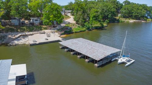 Lakeshore Fishing Cabin 5, dock, boat slip and firepit area