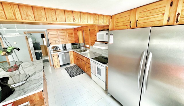 Lakeside Bliss Tait Lake – Cozy 3 Bed Cottage with Hot Tub & Private Waterfront!