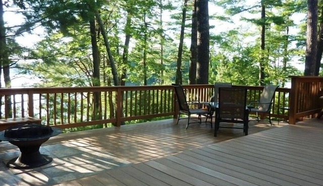 Lakeside Cottage in the Pines with Huge Deck, 40-foot Dock, and Sunset Views
