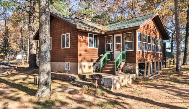 Lakeside resort cabin right on Little Saint with dock, sandy beach, firepit!