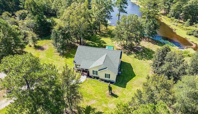 Lakeside Villa Retreat 5-Bedroom Oasis with 6 TVs, 3-Acres of Waterfront, Fishing & Canoe Adventures!