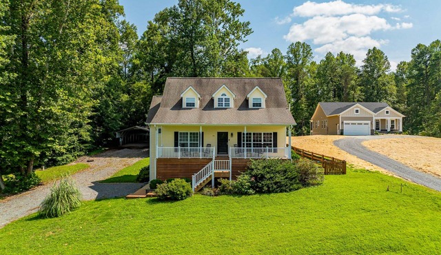 Lakeview escape near beach with fenced dog run, porch & dock with one boat slip