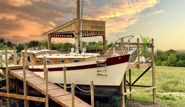 Land Ahoy! A historic boat, anchored in acres of greenery. 1 of a kind adventure