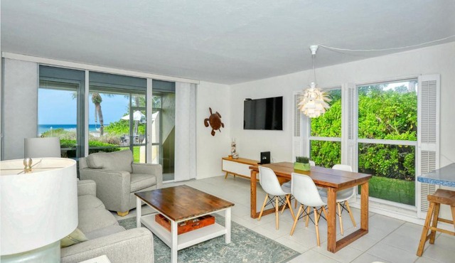 LaPlaya 101A Step out to the beach from your screened lanai Light and bright end unit