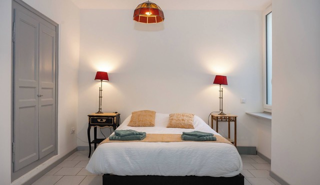 Large 8-person duplex with mountain and Rhone views and outdoor parking.