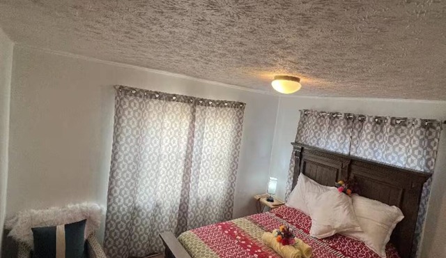 Large and neatly arranged house with a large parking lot .