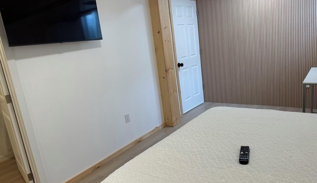 Large bedroom with private bathroom and workspace.