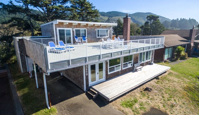 Large Deck at this Oceanfront home with Views of Twin Rocks, Beach and Lake