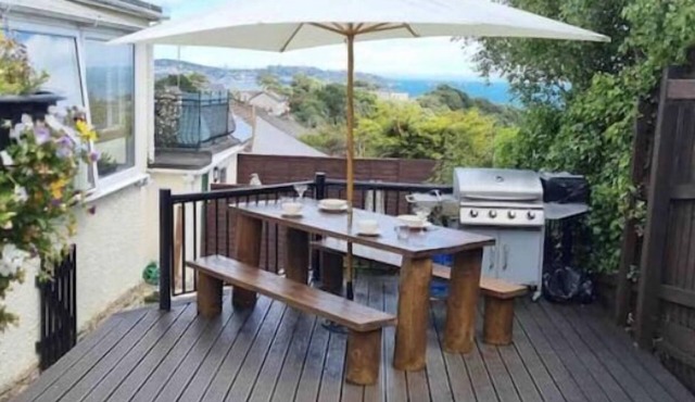 Large detached 3 bed bungalow. Great sea views. Hot tub with private gardens.