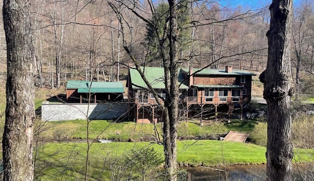 Large family mountain retreat on Buck Run with a stocked pond in Leetonia Pa.