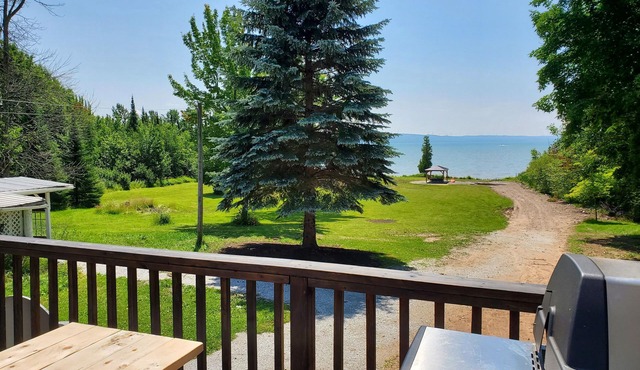 Large farmhouse style cottage located on three acres of waterfront property.