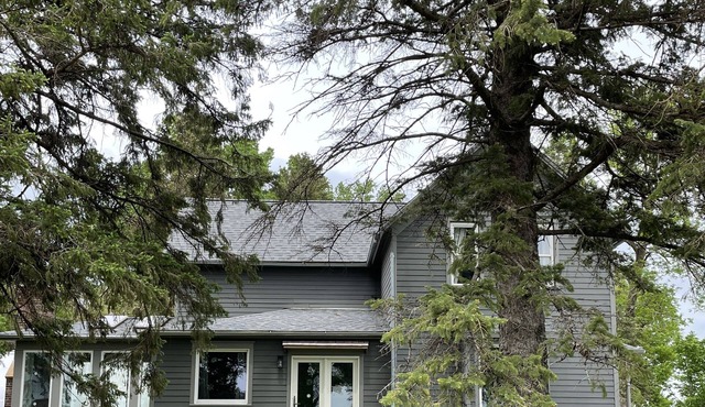 Large farmhouse with 80 acres of native prairie.