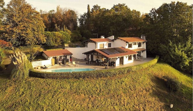 Large, friendly and comfortable house with exceptional views and large pool