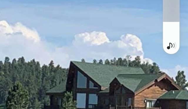 Large garage for bikes. Beautiful log home. On golf course.