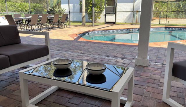 Large home, heated pool, game rooms, ping pong, golf, parks,ngated, many beaches