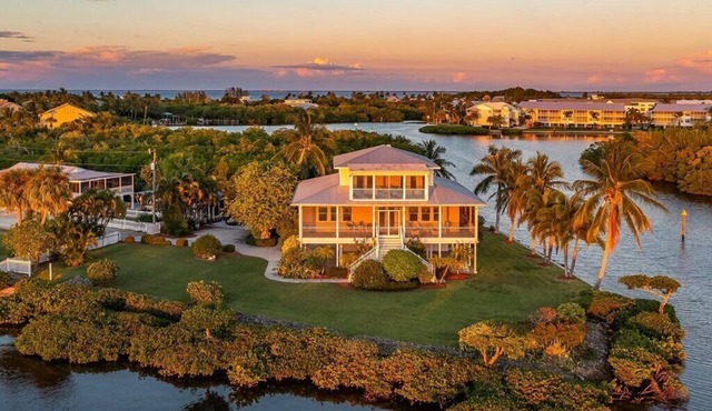 Large home on private penninsula with waterfront and views on three sides.