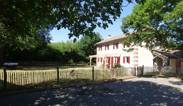 Large house between lake and forest