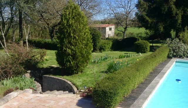 Large house over two floors with pool and gardens.