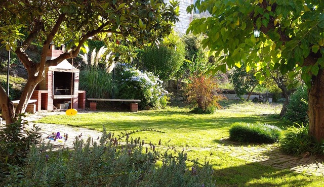 Large house with enclosed plot of 2000 m2, beautiful garden and barbecue.