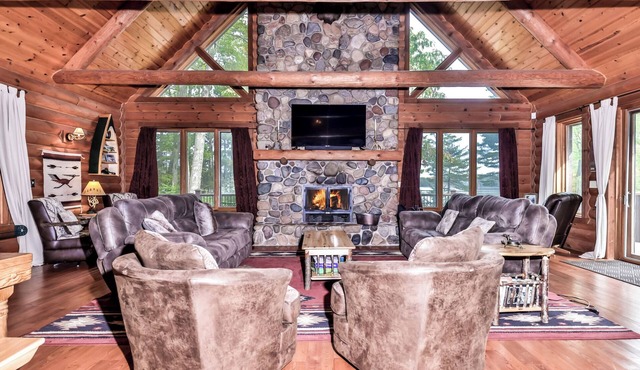 Large lakeside log home with air-hockey, foosball, dock, enclosed porch, firepit