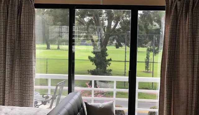 Large luxury studio with view in of golf course