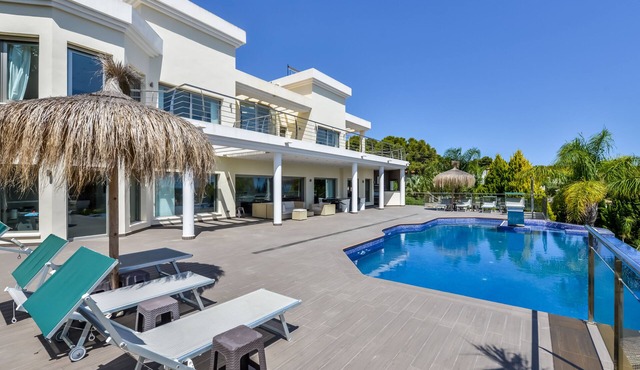 Large modern villa with indoor and outdoor pool sauna and bar.