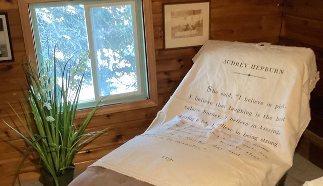 Large patio with patio furniture and an outdoor hot tub.