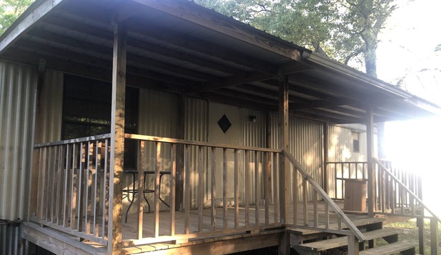 Large porches overlooking acres of lawn and pasture near lakes and rivers.