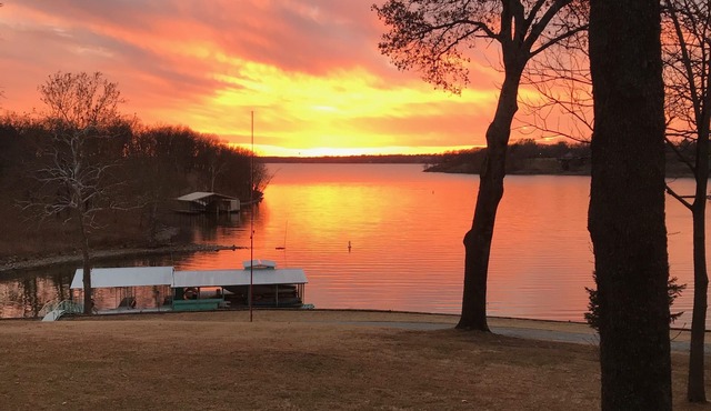 Large private acreage, very open space, decks, hot tub, treehouse, dock, more.