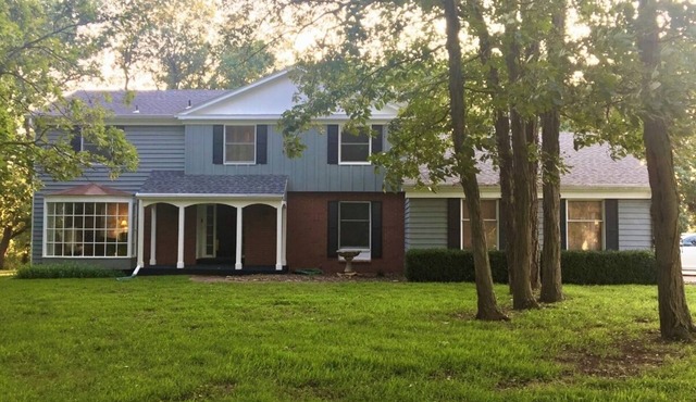 Large secluded 4-bedroom family home in the timber with views of Perry Lake.