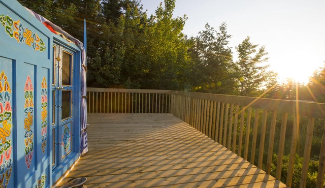 Large sky blue yurt at Cabot Shores Wilderness Resort