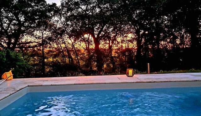 Large stone gîte for 12 people, swimming pool and boules pitch.